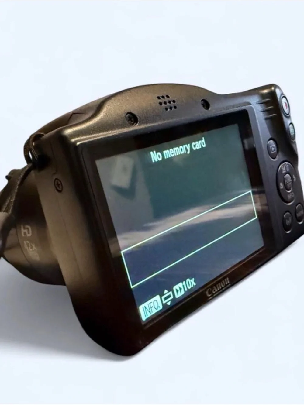 Canon PowerShot SX420 IS Digital Camera with Lens Cover, wrist wrap, and battery